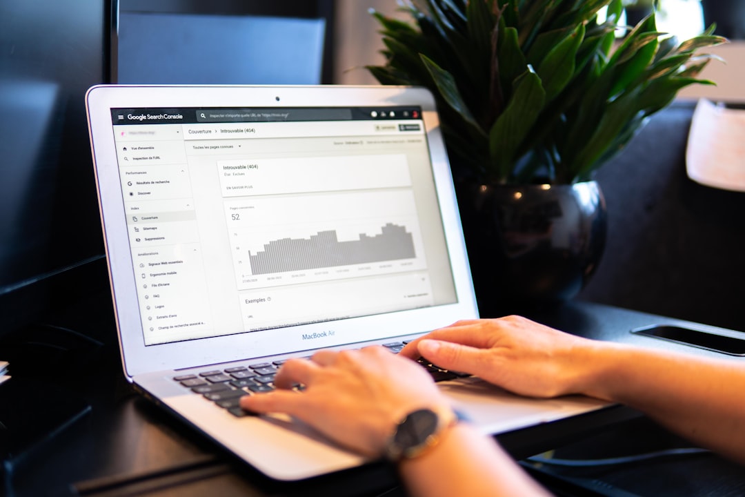 Person viewing a Google Search Console traffic chart on a laptop