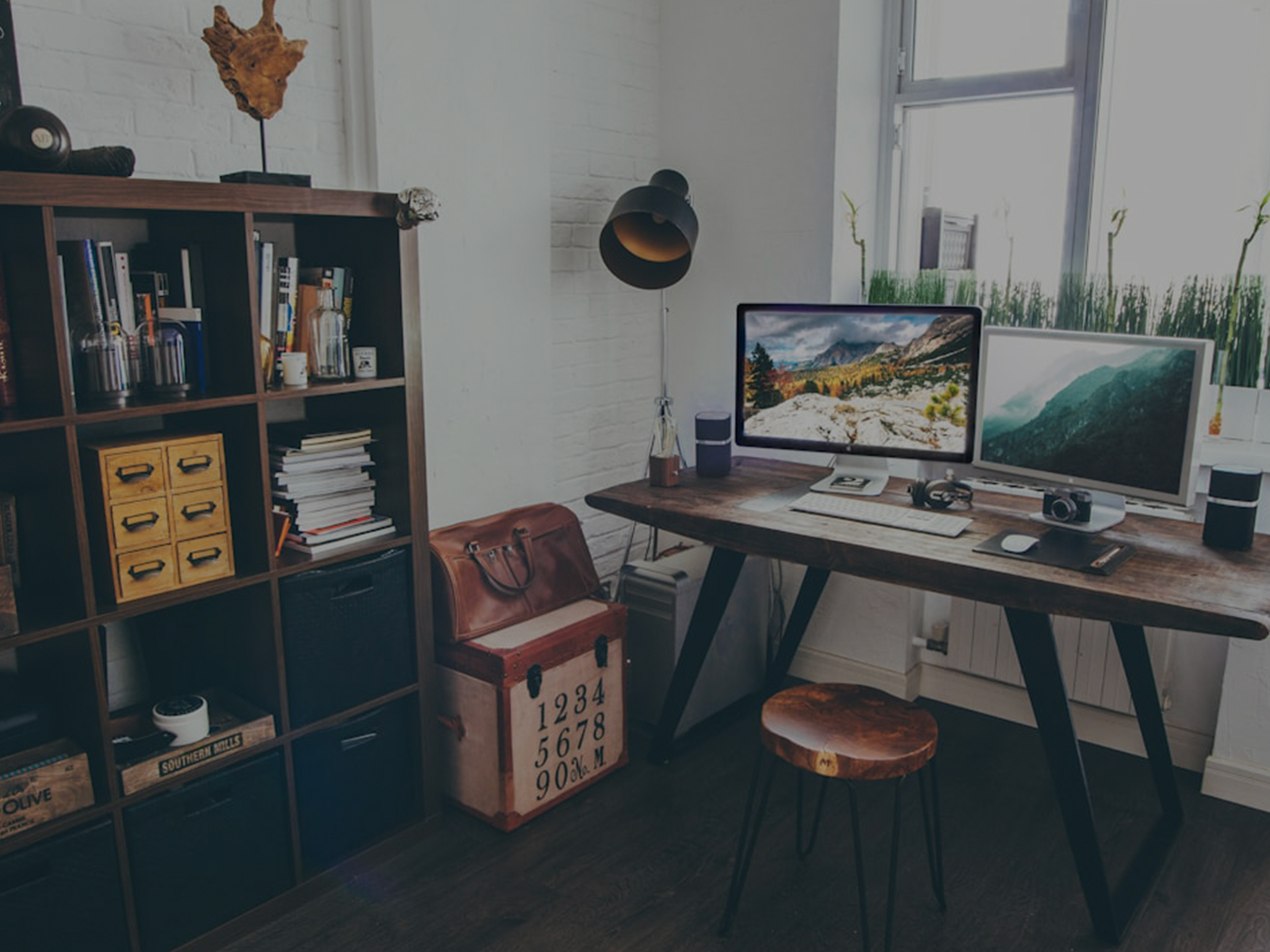 Home office desk with a website design on screen